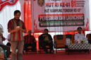 Keterangan Foto: Camat Mook Manaar Bulatn (MMB), Pit Anugerah Arruan Pasilong, saat membacakan sambutan tertulis Bupati Kutai Barat dalam rangka HUT Kemerdekaan RI ke-81 dan HUT Kampung Tondoh ke-13, sekaligus rangkaian peresmian website dan video profil Kampung Tondoh, Senin, 17 Agustus 2026. (Dok. Trackperistiwa.com/Melky Malis)